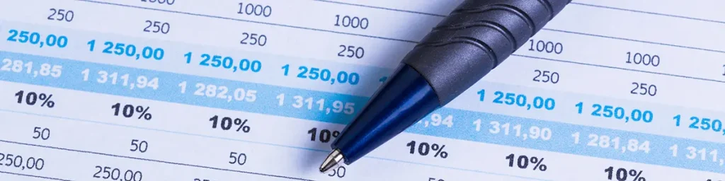 Image of business performance graph with ballpoint pen