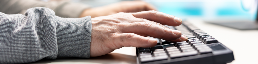 Cyber security expert typing on keyboard