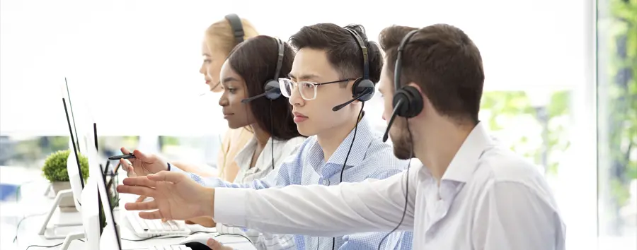 group of IT support technicians working together